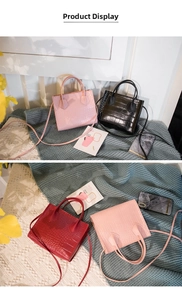 Detailed view of crocodile pattern mini handbags in pink, black, and red colors