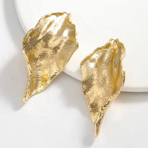 Polished gold leaf drop earrings with hammered texture and irregular geometric design
