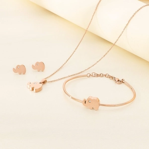 Rose gold elephant jewelry set with crystal eyes including necklace, bracelet, and earrings