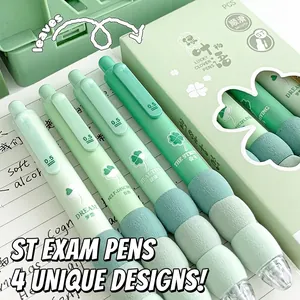 Detail of four mint green ST nib gel pens with soft modular grips on a notebook