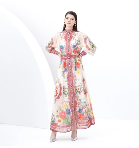 Detail of vintage long print dress with stand collar, lantern sleeves and waist belt