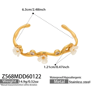 Detailed view of gold stainless steel cuff with floral zircon accents and dimensions