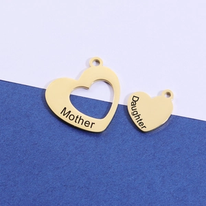Polished stainless steel heart pendant set featuring Mother and Daughter engraved charms