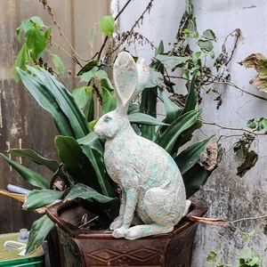 Vintage style resin rabbit garden sculpture with aged finish for outdoor patio decor