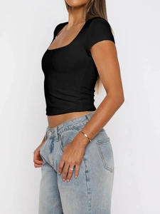 Side view of a slim-fit black short-sleeve crop top with a classic crew neck