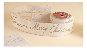 Detailed view of cream Merry Christmas ribbon with gold lettering on marble display