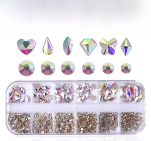 Detail of Crystal AB nail rhinestones in heart and butterfly shapes in a 12-grid box