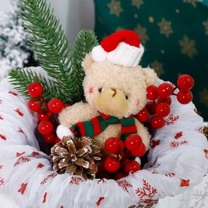 Christmas plush bear decoration with festive scarf and red berry floral accents