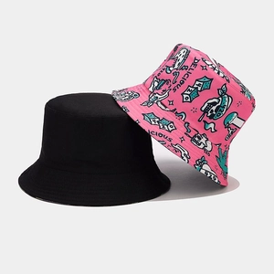Detail showing two-sided bucket hat with floral print and solid black cotton fabric