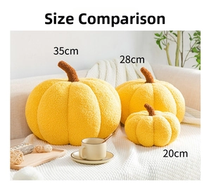 Three sizes comparison of soft orange pumpkin pillows on a cozy Nordic style sofa