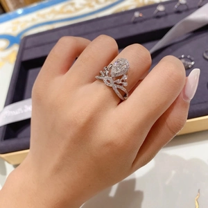 Luxurious 18K white gold plated pear shape diamond ring featuring crown micro-pave design