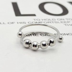 Adjustable stainless steel anti-anxiety ring with sliding beads and double-loop design