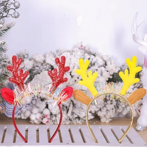 Christmas reindeer antler headbands with glitter and bells in festive holiday setting