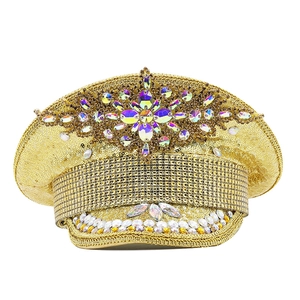 Macro shot of gold sequin party hat featuring iridescent rhinestones and large gemstones