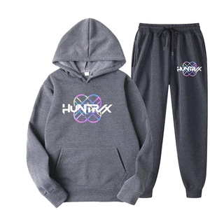 Detail of dark gray cotton tracksuit set showing HUNTRVX logo on hoodie and sweatpants
