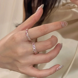 Exquisite rose gold pink crystal eternity rings with micro-pave setting on model's fingers