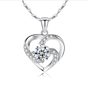 Elegant silver heart pendant necklace with white crystals and sparkling stones on white background