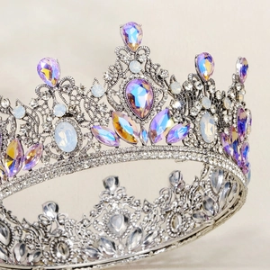 Macro shot of silver baroque bridal crown with multicolored iridescent rhinestones