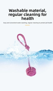 Washable purple knotted cotton rope dog toy splashing into clean water for hygiene