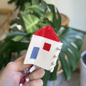 Handheld red house shaped acetate hair claw clip with a cute cottage design for women