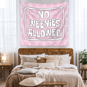 Pink bohemian tapestry featuring NO WEENIES ALLOWED text and smiley faces for bedroom decor