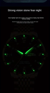 Luminous quartz watch dial detail showing glowing green hands and double calendar window