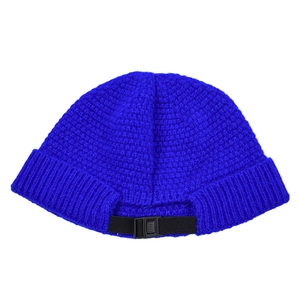 Close-up of royal blue knit hat featuring adjustable black plastic strap back detail