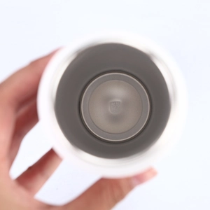 Detail shot of SUS 304 food-grade stainless steel interior lining in white travel bottle