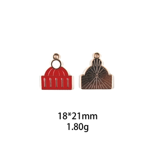 Front and back detail of 18x21mm red enamel building charm with gold metal texture