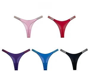 Detail of five colorful thongs with glittering rhinestone straps and mesh patchwork fabric