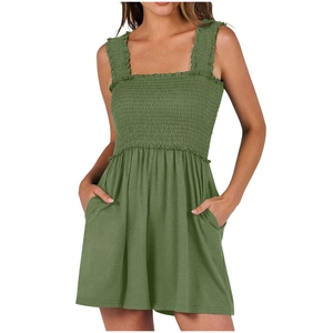 Detailed view of the olive green strapless romper with smocked bodice and side pockets