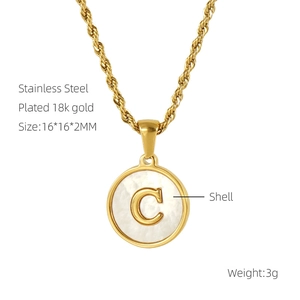 Detail of 18k gold plated stainless steel necklace with shell inlay and letter C pendant