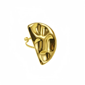Macro detail of the golden abstract face ring with high-gloss polished metal finish