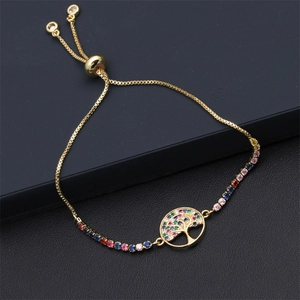Close-up of golden Tree of Life bracelet with colorful zircon stones and slider clasp