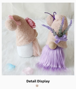Detailed close-up of handmade Valentine gnomes with plush hats and floral decorations
