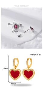 Detail view of heart stud earrings and drop earrings with sparkling micro-inlaid rhinestones