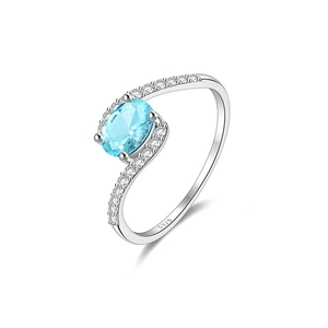 Detailed macro view of S925 sterling silver ring with light blue oval gemstone and diamonds