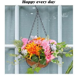 Detail of hanging flower basket with artificial pink daisies and natural coco liner