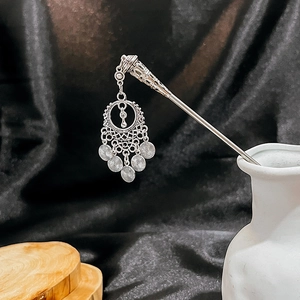 Vintage silver metal hairpin with turquoise hollow flower tassels in white ceramic vase