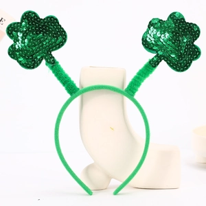 Detail of St. Patrick's Day headband with sparkling green sequined shamrock ornaments