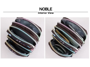 Detail view of the four-layer zipper compartments in a compact nylon floral crossbody bag