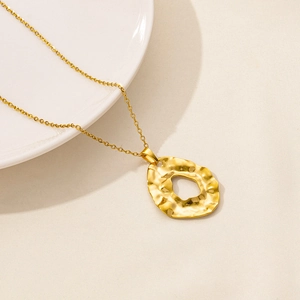 Retro 18k gold plated stainless steel necklace featuring a hollow circular pendant