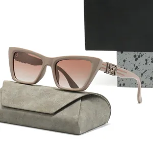 Beige cat-eye polarized sunglasses with gradient lenses and metallic logo temple detail