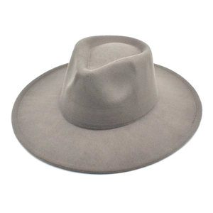 Macro detail of high-quality grey wool felt fedora with stitched wide brim edge