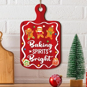 Christmas gingerbread man wooden cutting board sign with Baking Spirits Bright text