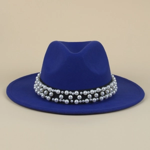 Detail of royal blue wool fedora featuring an elegant black ribbon with faux pearl accents