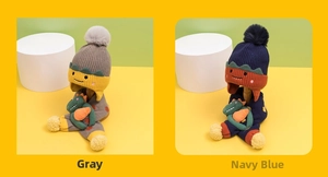 Detail of dinosaur cartoon knit hat and scarf set in grey and navy blue for kids