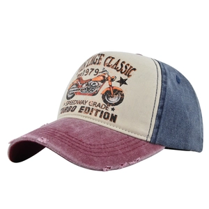 Close-up of vintage tricolor mesh baseball cap with motorcycle print and washed cotton texture