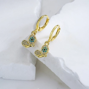 Detail of 18K gold plated hoop earrings with blue zircon butterfly evil eye charm