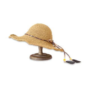 Detailed close-up of straw sun hat with leopard print string, yellow beads and black tassels
